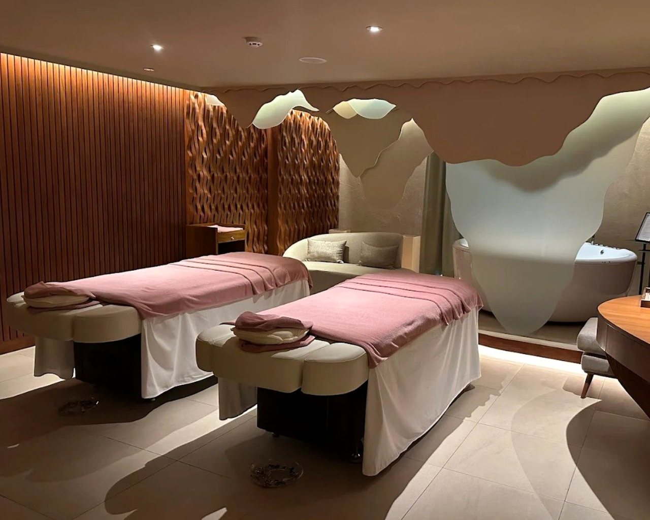 A warm, quiet spa treatment room — the restorative setting where the nervous system returns to its repair state