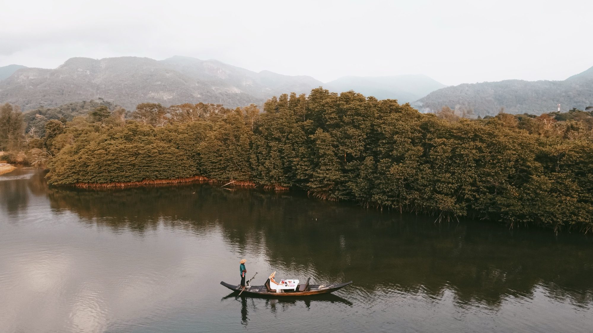 A luxury medical and wellness retreat in Thailand — a quiet lake at dawn.